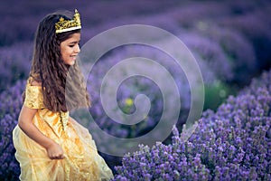 Gorgeous young girl in the lavender field at sunset