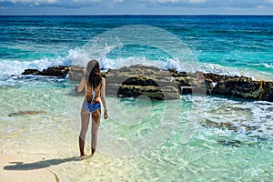 Gorgeous young woman in a swimsuit on the sea. Attractive girl w