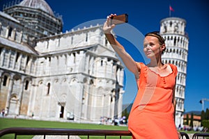 Gorgeous young woman taking a selfie with her smart phone