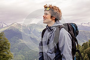 Gorgeouse backpacker is looking at the mountain