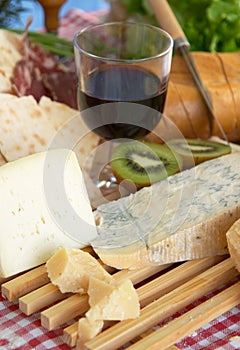 Gorgonzola, parmigiano, pecorino cheese, with wine and bread