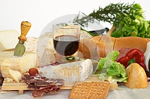 Gorgonzola, parmigiano, pecorino cheese, with wine and bread photo