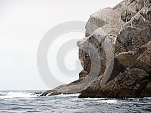 Gorilla face rock in Arraial do Cabo, Rio de Janeiro