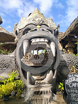 Gorilla statue  Tukad cepung Bangli waterfall nameplate