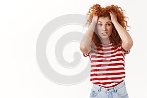 Gosh how cope problems. Bothered troubled young tired redhead curly woman worry feel anxious panic grab hair hands