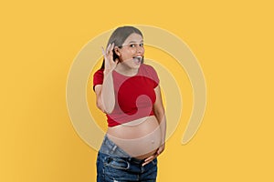 Gossip Concept. Curious pregnant woman holding hand near ear to overhear news