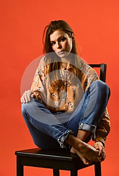 She got great style. lonely woman sit on chair. phycology. portrait of woman with beauty face. female fashion style