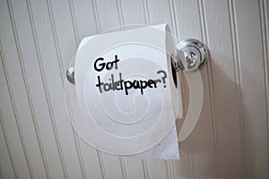 `Got Toilet Paper`, written in sharpie on a toilet paper roll