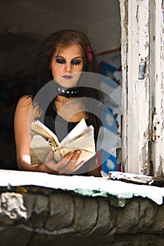 Goth girl reading a book