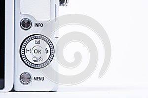 Gothenburg, Sweden - June 18 2019: Navigation buttons of a white Olympus E-PL6 with 40-150mm lens on white background.. photo