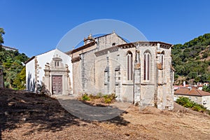 Gothic apse of the Santa Cruz Church with a view of the baroque chapel and portal.