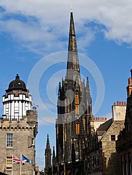 Gothic architecture of Tolbooth Church beside Camera Obscura dome in Edinburgh Scotland