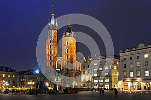 Gothic basilica of Virgin Mary Kosciol Mariacki on the main market square Rynek Glowny at night, Cracow, Poland.