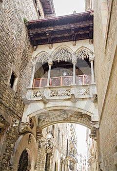 Gothic bridge in Carrer del Bisbe street, in Barcelona, Spain photo