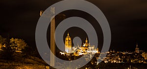 Gothic cathedral and mirador de la Piedad cross by night, Segovia, Spain