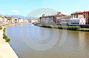 Gothic church along river Arno in Pisa, Italy