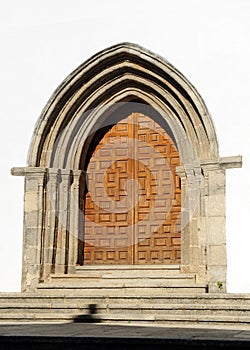 Gothic door of the church of Saint John Baptist -San Juan Bautista- in Bejar, Salamanca province, Spain