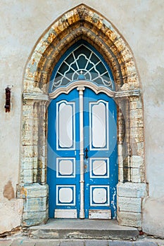 Gothic door on a medieval building facade