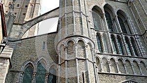 Gothic facade and tall belfry of the Church of Our Lady, Bruges, Belgium