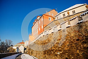 Gothic Fortress walls in winter sunny day  waterfront buildings over Otava River  Medieval fortifications  historical