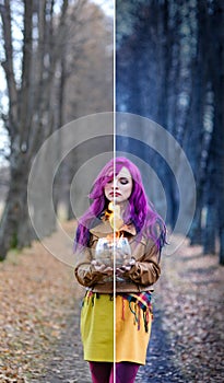 Gothic Girl with purple hair is standing with a burning glass in her hands in the alley in the autumn forest. Concept editing, pho