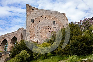 Gothic medieval castle Velhartice in sunny day, tower and stone arch bridge, fortress masonry wall, old stronghold, Velhartice,