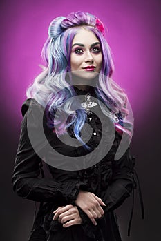 The gothic multi-colored hair girl on a violet background