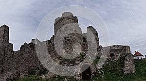 Gothic part of castle Levice, Slovakia, against spring blue sky