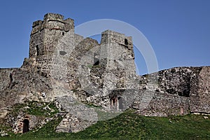 Gothic part of castle Levice, Slovakia, against spring blue sky