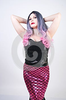 Gothic plus size adult mermaid on white studio background