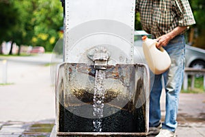 Gothic spigot installed on a flowing artesian wellhead. Selective focus.