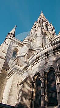 The Gothic spire of an Anglican church in Cork, Ireland. Neo-Gothic Christian religious architecture. Cathedral Church of St Fin