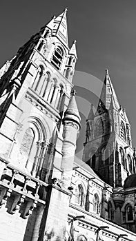 The Gothic spire of an Anglican church in Cork, Ireland. Neo-Gothic Christian religious architecture. Cathedral Church of St Fin