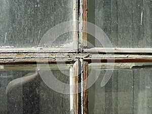 Gothic style cross. Christian cross in the window. Abstract cross in church interior