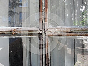 Gothic style cross. Christian cross in the window. Abstract cross in church interior