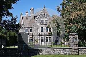 Gothic style mansion behind fence