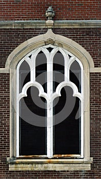 Gothic style window frame in a brick church