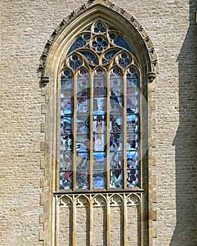 Gothic window with colored vitrage photo