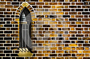 Gothic window in the orange brick wall