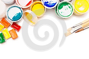 Gouache paint, watercolours and brushes photo
