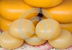 Gouda cheese rounds stacked