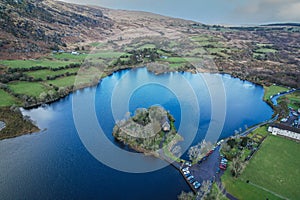 Gougane Barra, County Cork, Ireland, where water flows gracefully around a historic chapel