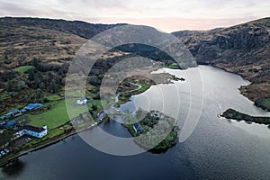 Gougane Barra, County Cork, Ireland, where water flows gracefully around a historic chapel