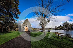 Gougane Barra, County Cork, Ireland, where water flows gracefully around a historic chapel