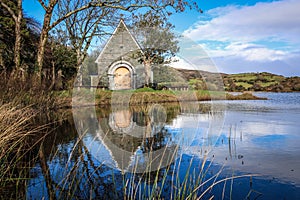 Gougane Barra, County Cork, Ireland, where water flows gracefully around a historic chapel