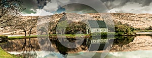 Gouganebarra Lake and the river Lee outside of Saint Finbarr`s Oratory chapel in county Cork, Ireland