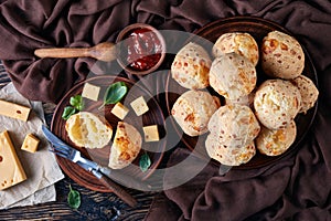 Gougeres, cheese puffs balls on a clay plate