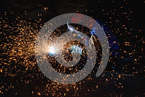 Gouging welding steel structure and bright sparks in steel construction industry.