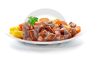 Goulash, beef stew with potatoes, isolated on white background