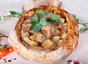 Goulash in bread bowl